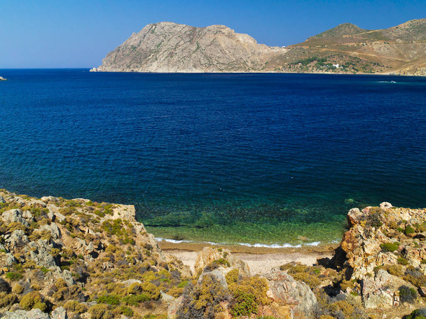 Beautiful greek summer sunny beach bay. View to aegean blue sea with awesome turquoise water. Island paradise. Psili Ammos Beach, Patmos Island, Dodecanese, Greece - Photo, Image