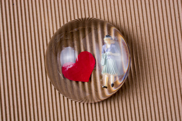Woman figurine and Love concept with paper hearts  - Photo, Image