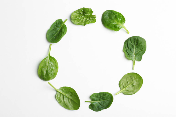 Frame made of spinach leaves on white background, top view. Space for text - Fotoğraf, Görsel