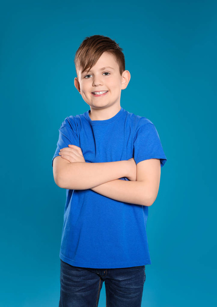 Portrait of little boy on color background - Foto, Imagen