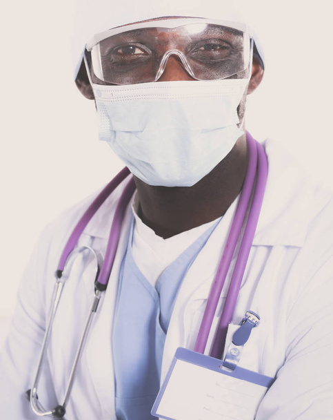 Portrait of a doctor wearing a mask and uniform. isolated on white background. Doctor. - 写真・画像