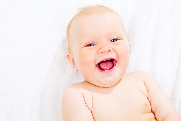 Cute pleased kid on towel - Photo, Image