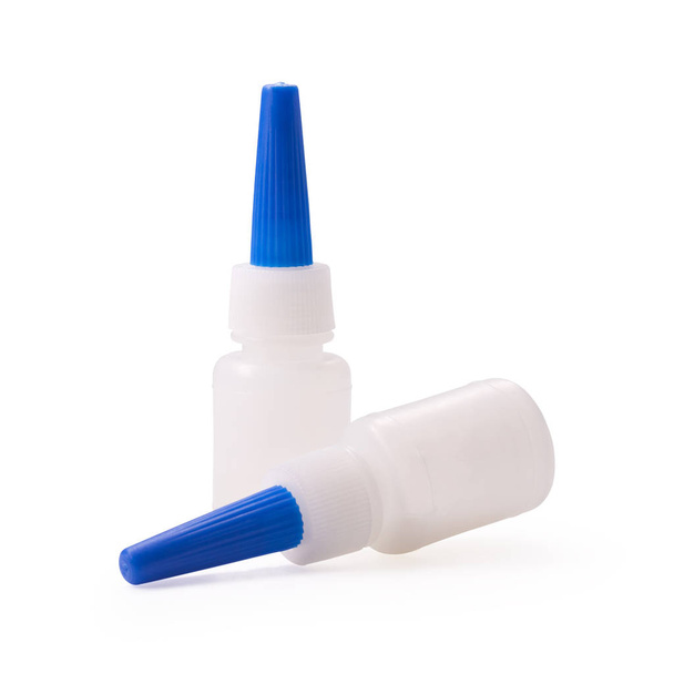 Glue bottle on isolated background with clipping path. Blue plastic packaging for your design. - Photo, Image