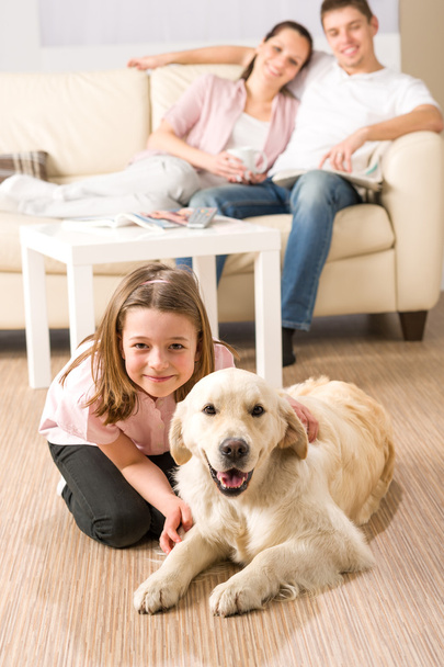 A happy family of three with dog - Foto, Imagen