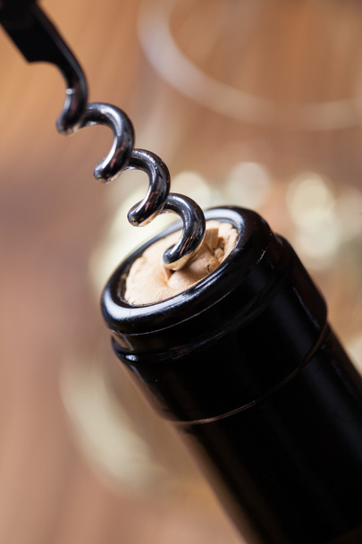 Bottle of wine with a corkscrew - Fotografie, Obrázek