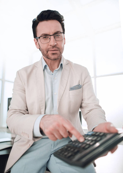 close up. businessman with calculator. - Foto, Imagem