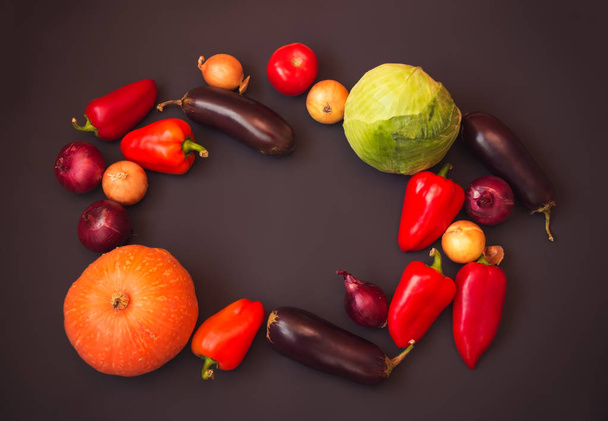 Frame made of different fresh vegetables on dark background.  - Foto, immagini