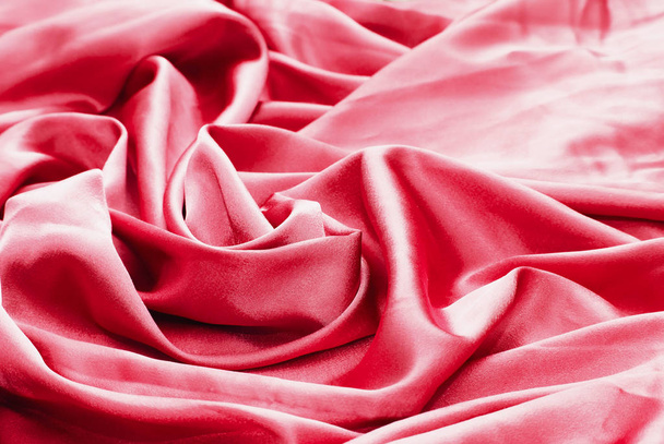 Texture, background. Red or pink silk drapery and upholstery fabric from the courtyard - Fotó, kép