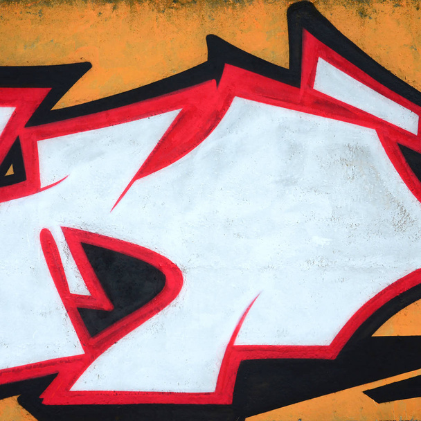 Fragmento de pinturas de graffiti de arte urbano de colores con contornos y sombreado de cerca. Textura de fondo de la cultura del arte contemporáneo juvenil. Colores naranja, rojo y negro
 - Foto, imagen
