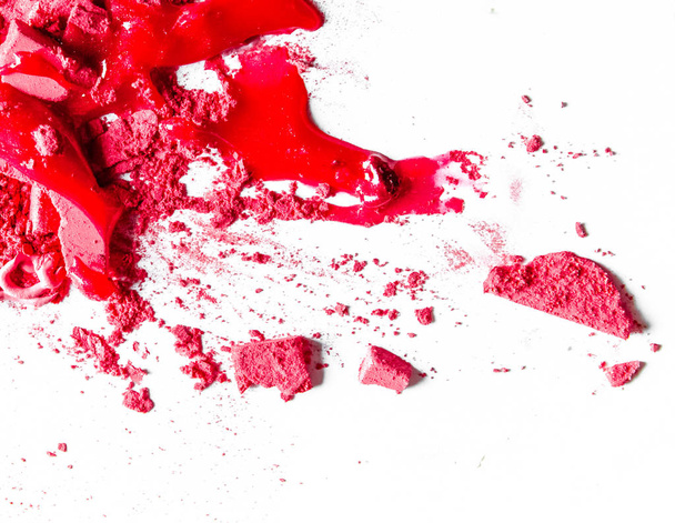 Crushed eyeshadows, lipstick and powder isolated on white backgr - Foto, imagen