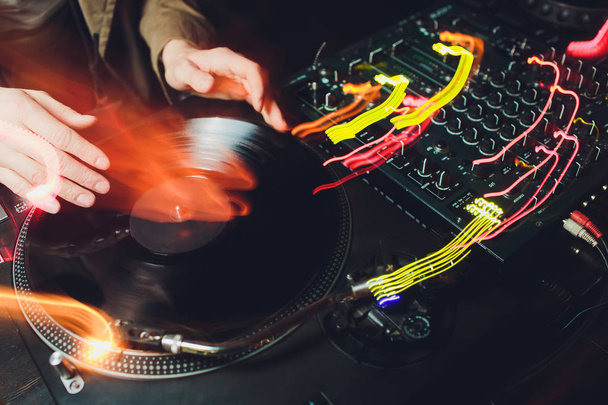 a vinyl record on the panel of the DJ. DJ equipment. - Фото, изображение