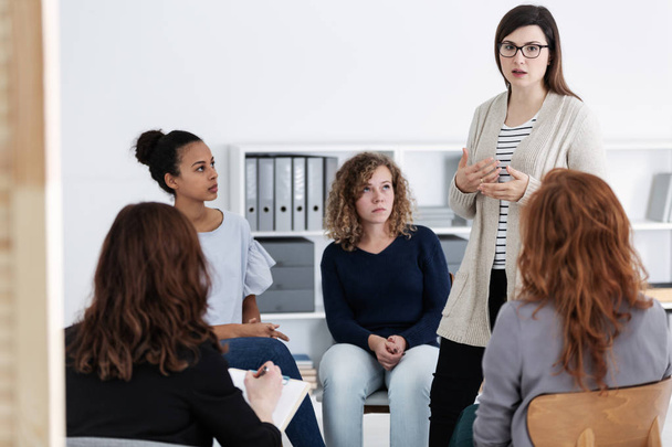 women supporting each other during psychotherapy group meeting - Photo, image