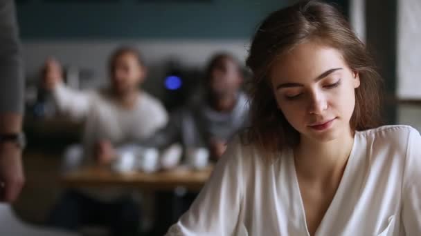 Millennial guy get acquainted talking to pretty girl in cafe - Felvétel, videó