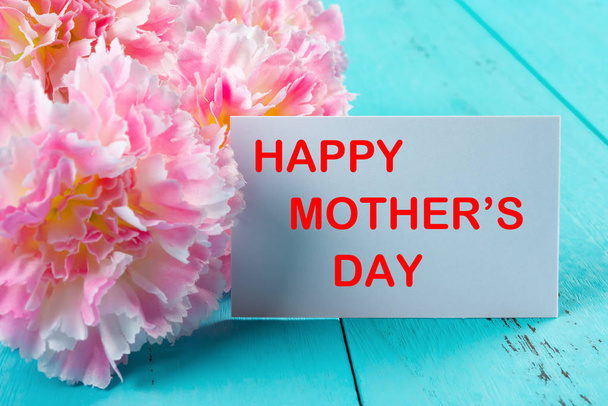 carnations and card written with happy mothers day the removeable words inside clipping path - Photo, Image