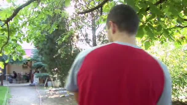 Man carrying a little boy - Filmati, video