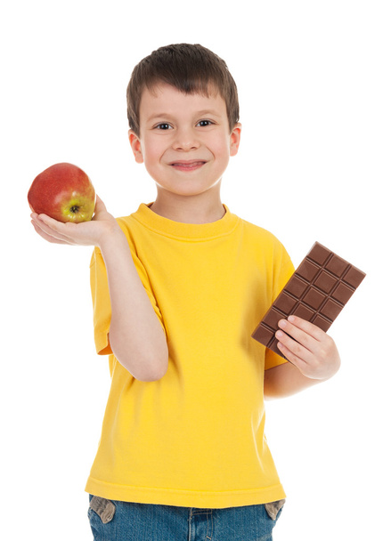 boy with apple and chocolate - Photo, Image
