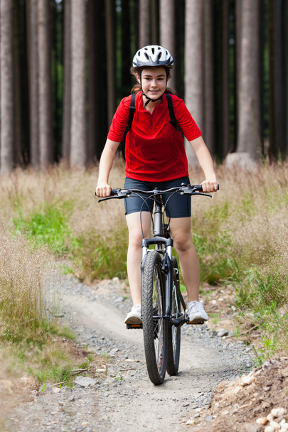 Healthy lifestyle - teenage girl biking - Photo, Image