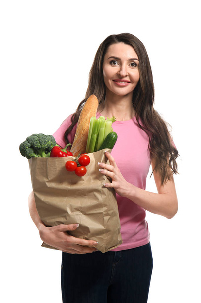 Γυναίκα με υγιή προϊόντα σε λευκό φόντο - Φωτογραφία, εικόνα