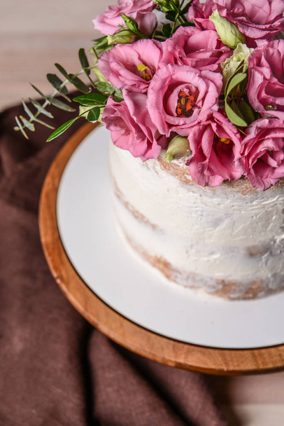 Sweet cake with floral decor on table, closeup - Фото, зображення