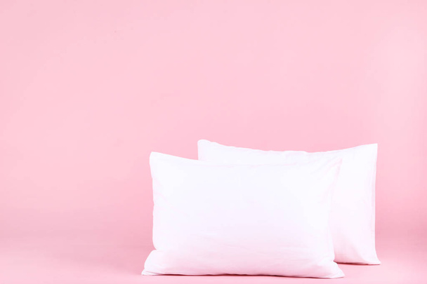 Soft white pillows on pink background - Foto, immagini