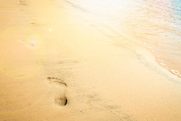 Beautiful footprints on the beach in nature by the sea - Photo, Image