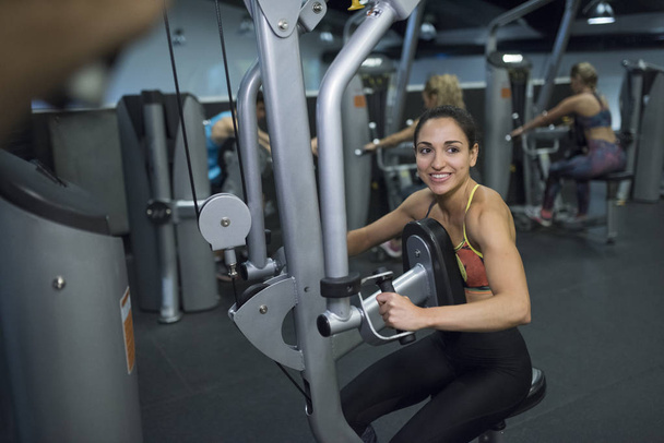 Young woman training at gym - Photo, Image