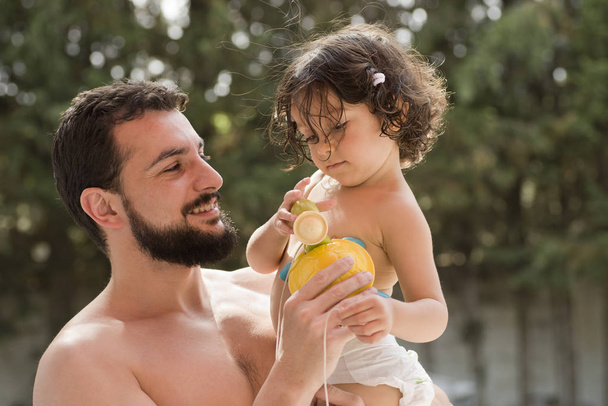 father and baby playing in summer day - Foto, Imagem