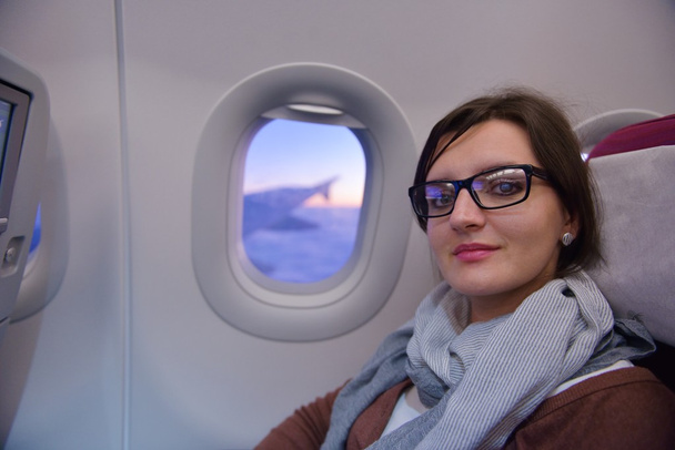 woman in airplane travel - Фото, изображение