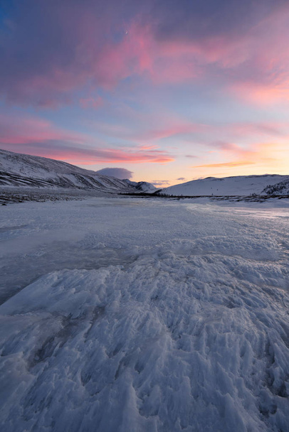 Dramatic sunset over the icy lake in the Arctic tundra. Yamal peninsula. - Fotó, kép
