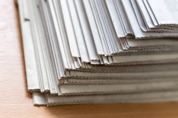 A stack of newspapers close-up. Lots of jagged paper sheets. - Photo, Image