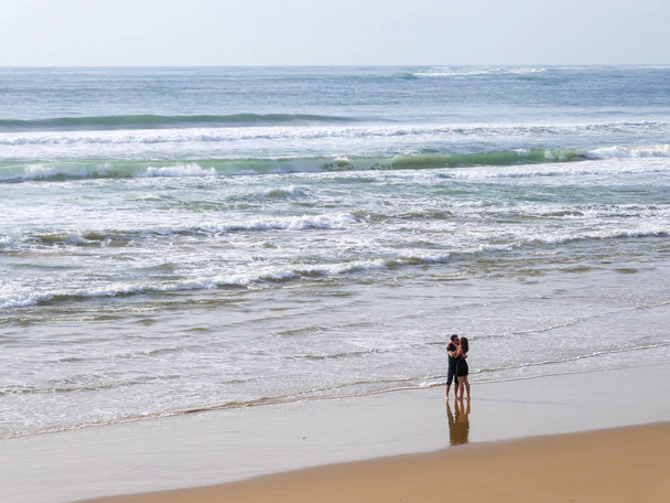 Happy Romantic Couple Enjoying Beautiful Walk on the Beach. Travel Vacation Lifestyle Concept - Photo, Image
