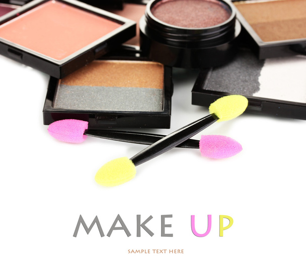 Bright eye shadows and sponge brushes for foundation close up - Fotoğraf, Görsel