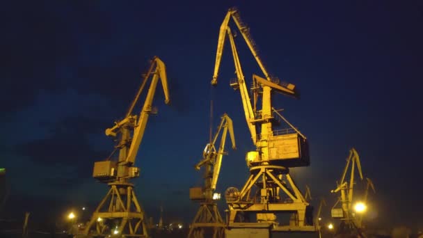 Sea port cranes over sunset. 4K - Footage, Video