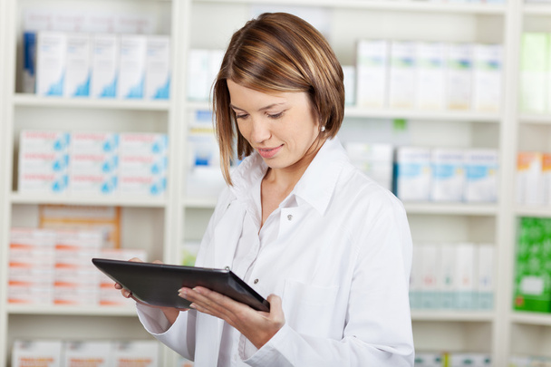 Pharmacist working with a tablet-pc - Photo, image