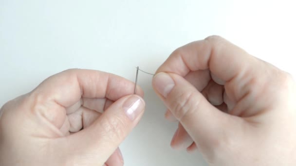 Unsuccessful threading the needle. Here the woman either needs eyeglasses or needle threader. - Footage, Video