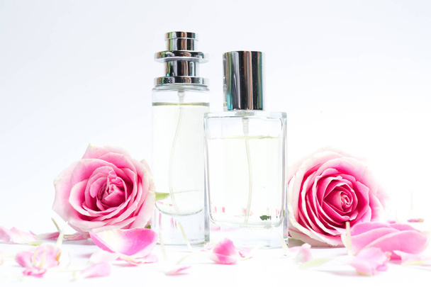 Perfume bottles on pink background - Foto, imagen