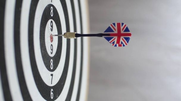 Dart hitting bulls eye, single shot bulls-eye. Concept of successful business ideas hitting the exact center of the target. Perfect performance of the task and superiority over the rivals. - Photo, Image
