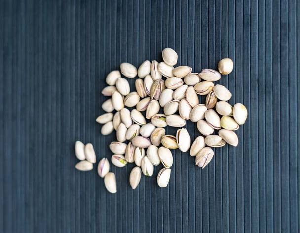 Healthy food  for background image close up pistachios nuts. Texture Nuts on top view mock up pistachio - Fotó, kép