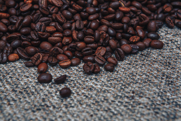 Coffee beans and sackcloth background. Copy Space - Фото, зображення