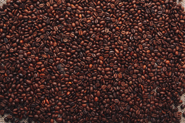 Roasted coffee beans. Can be used as a background. - Photo, Image