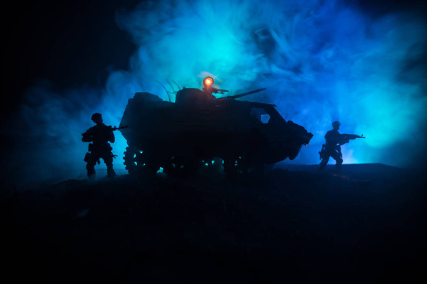 War Concept. Military silhouettes fighting scene on war fog sky background, Silhouette of armored vehicle below Cloudy Skyline At night. Attack scene. Tanks battle. Artwork decoration - Photo, Image