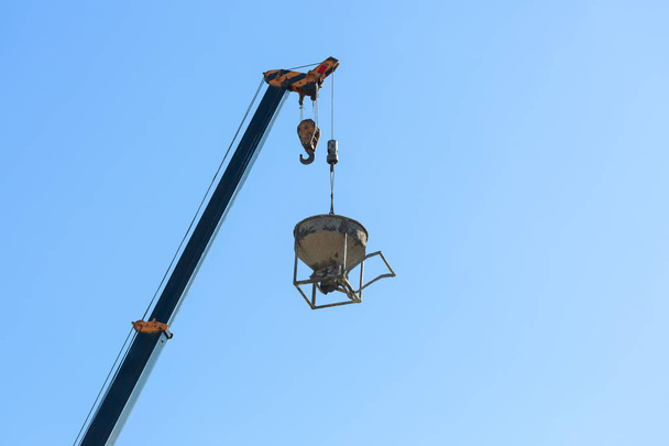 machinery crane hoisting cement mortar mixer bucket - Photo, Image