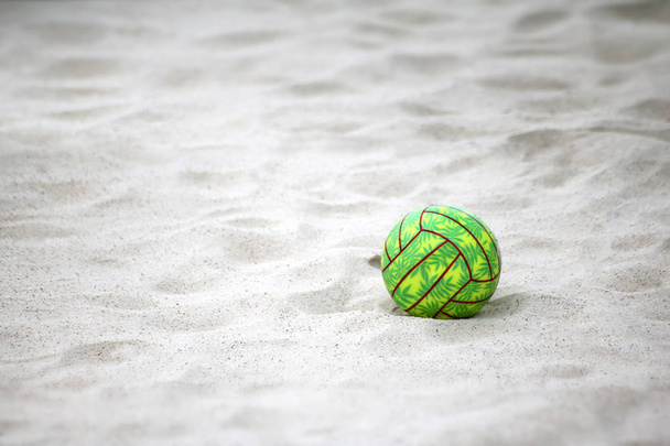 Green volleyball on the sand beach. - Photo, Image