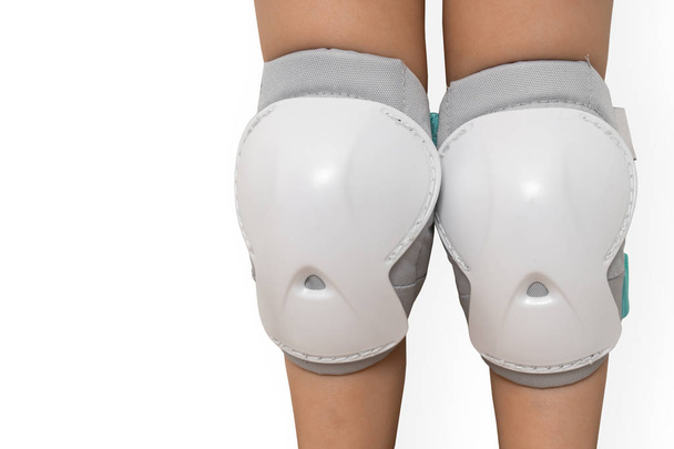 Pair of knee pads wearing on legs of child - Photo, Image