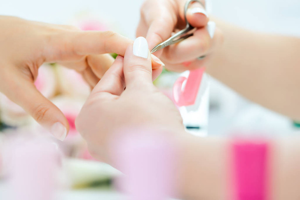 Woman having her finger nails cut during manicure - Foto, Imagen