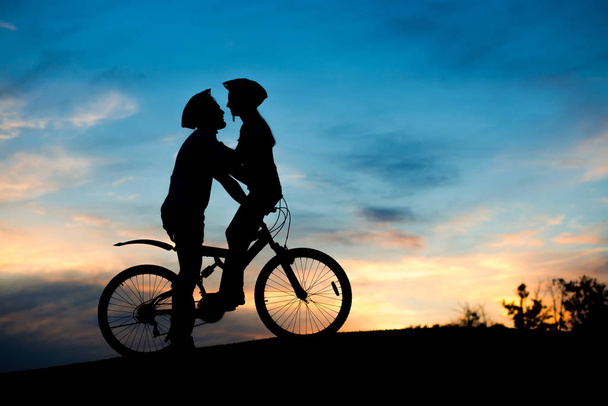 Kissing romantic couple in love at sunset. - Fotografie, Obrázek