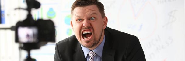 Businessman blogger online couch screaming - 写真・画像