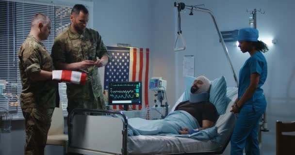 Injured soldier receives badge of honor in hospital - Footage, Video