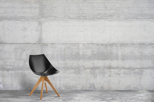 Σχεδιαστής, μοντέρνα πολυθρόνα σε γκρίζο, στιλ σοφίτας εσωτερικό με τσιμεντένιο τοίχο - Φωτογραφία, εικόνα