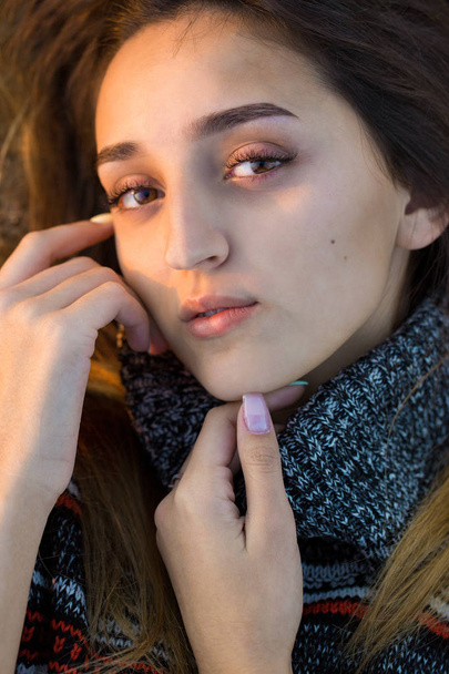 Portrait of beautiful young woman in warm sweater - Zdjęcie, obraz
